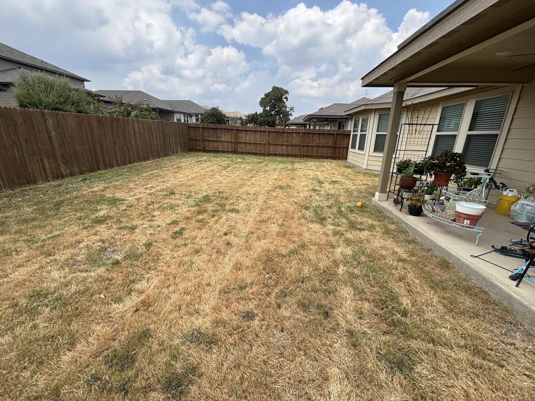 Residential backyard lawn mowing and maintenance service by Urban Landscaping San Antonio Texas